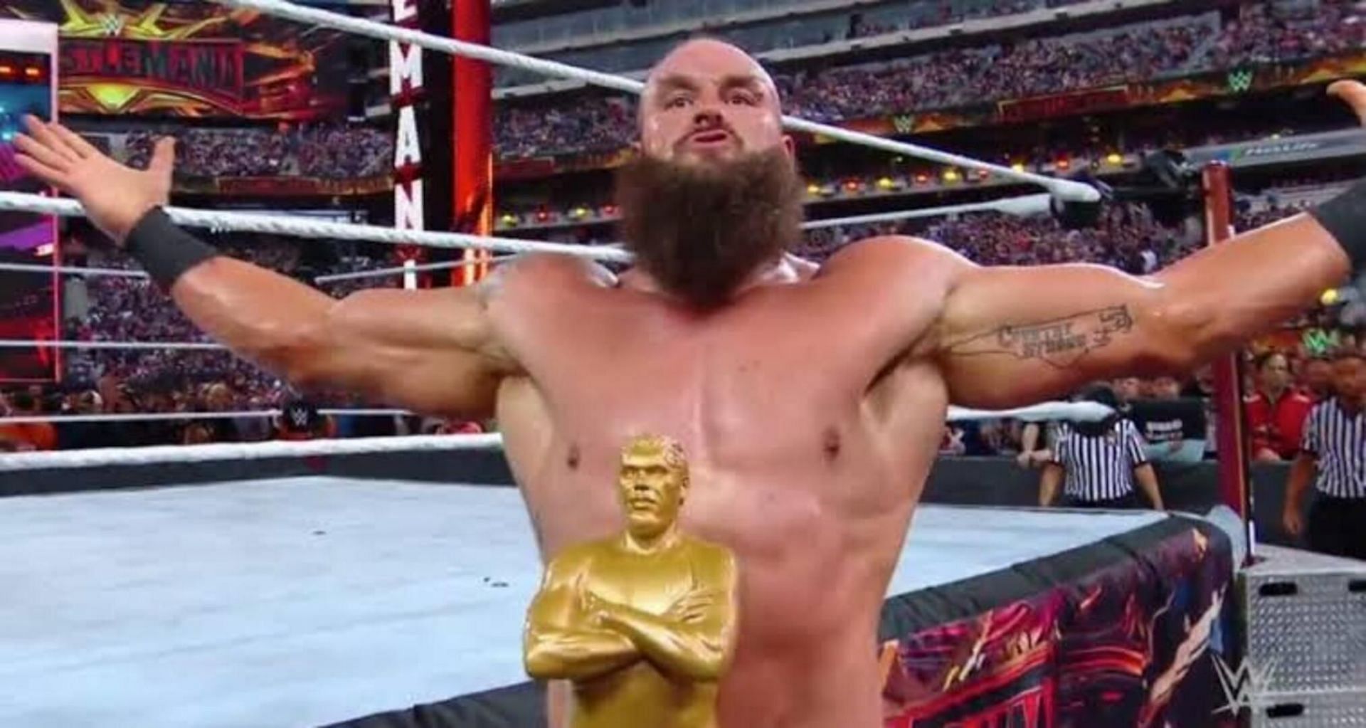Braun Strowman with André the Giant trophy.
